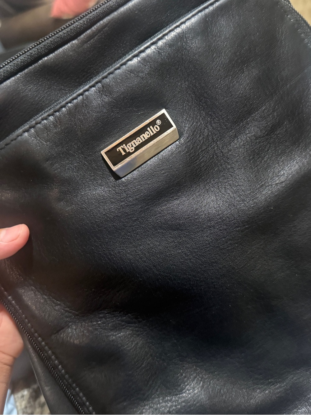 Tignanello Black Leather Wristlet with Metal Logo Plaque